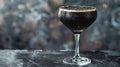 Black cactel in a glass on a dark background. Close-up. Royalty Free Stock Photo