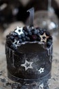 Black cake with stars and berries