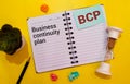 a black calculator, a pen, and a notebook with the text BCP Business Continuity Plan Royalty Free Stock Photo