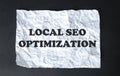 Black calculator with text Local Seo Optimization on the white background