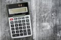 A black calculator on weathered wood Royalty Free Stock Photo