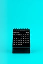 Black Calendar for February 2024. Desktop calendar on a green background
