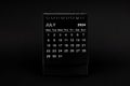 Black Calendar for July 2024. Desktop calendar on a black