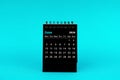 Black Calendar for June 2024. Desktop calendar on a green background