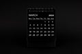 Black Calendar for March 2024. Desktop calendar on a black background