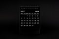 Black Calendar for May 2024. Desktop calendar on a black background