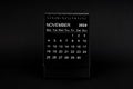 Black Calendar for November 2024 . Desktop calendar on a black background