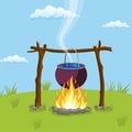 Black camping pot over a bonfire Royalty Free Stock Photo