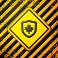 Black Canada flag on shield icon isolated on yellow background. Warning sign. Vector Royalty Free Stock Photo