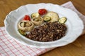 Black canadian rice served with mushrooms, tomatoes and zucchini