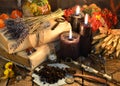 Black candles, old books, lavender flowers and magic objects on witch table Royalty Free Stock Photo