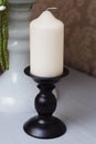 Black Candlestick with Candle on Table. Decoration Accesories. Interior Design. Royalty Free Stock Photo