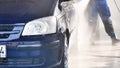 Black car being washed in automatic car wash station Royalty Free Stock Photo