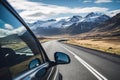 black car driving along a scenic highway in Iceland, passing through picturesque countryside Royalty Free Stock Photo