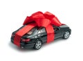 Black car for a gift with a red bow Royalty Free Stock Photo