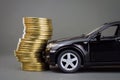 Black car hit pile of coins Royalty Free Stock Photo