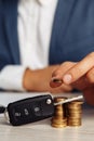 Black car key with contract and man with money on wooden table. Concept business finance and insurance Royalty Free Stock Photo