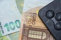black car key lie on euro money as background, auto insurance Royalty Free Stock Photo