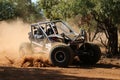 Black car kicking up dust during speed timed trial event of comp