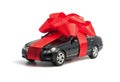 Black car with red bow Royalty Free Stock Photo