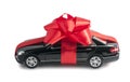 Black car with a red bow Royalty Free Stock Photo