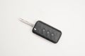Black car remote key with three buttons on  white background Royalty Free Stock Photo