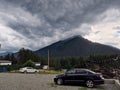 Black car sedan in the mountains. Autotravel. Mountain life and tourism infrastructure. Arkhyz, Karachay-Cherkessia, mountains of Royalty Free Stock Photo