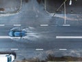 black car splashes through water puddle on flooded street. aerial photo Royalty Free Stock Photo