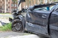 Black car after a terrible accident on the side of the road. Frontal and side impact. Life insurance. An accident without the Royalty Free Stock Photo