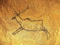 Black carbon paint of deer on sandstone wall