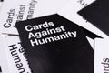 Black cards against humanity card viewed at an angle, flat lay of many cards on the table Royalty Free Stock Photo