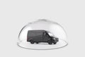 Black cargo delivery truck protected under a glass dome