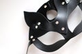 Black carnival cat style mask made of leather with rhinestones on white background Royalty Free Stock Photo