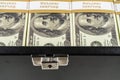 Black case full of dollar bills close up.Money bricks in case Royalty Free Stock Photo