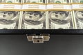 Black case full of dollar bills close up.Money bricks in case Royalty Free Stock Photo