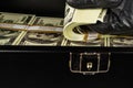 Black case full of dollar bills close up.Money bricks in case Royalty Free Stock Photo