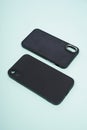 Black case for iPhone, isolated on blue background. Royalty Free Stock Photo