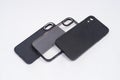 Black case and transparent case for iPhone, isolated on white background. Royalty Free Stock Photo