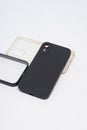 Black case and transparent case for iPhone, isolated on white background. Royalty Free Stock Photo