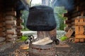 Black cast iron boiler in the capm, cooking in nature on campfire Royalty Free Stock Photo