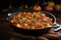 a black cast iron skillet with sizzling chicken tikka masala