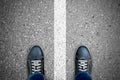Black casual shoes standing over white line Royalty Free Stock Photo