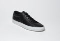 Black casual sneakers with black base and white background