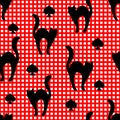 Black cats and card suit spades silhouettes. Vector seamless pattern on a red checked background Royalty Free Stock Photo