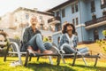 Female friends outdoor on daybeds enjoying autumn sunlight