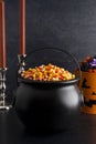 Black Cauldron For Witches FIlled with Candy Corn Royalty Free Stock Photo