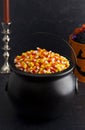 Black Cauldron For Witches FIlled with Candy Corn Royalty Free Stock Photo