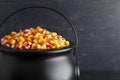 Black Cauldron For Witches FIlled with Candy Corn Royalty Free Stock Photo