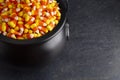 Black Cauldron For Witches FIlled with Candy Corn Royalty Free Stock Photo