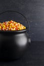 Black Cauldron For Witches FIlled with Candy Corn Royalty Free Stock Photo